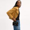 Rainer Crossbody-veske 18 med vattert mønster