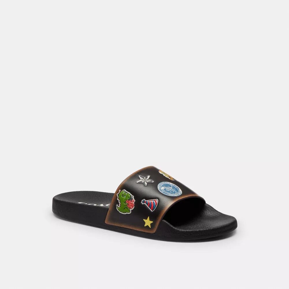 Rexy 10-årsdag Slides-sandaler med klistremerketrykk