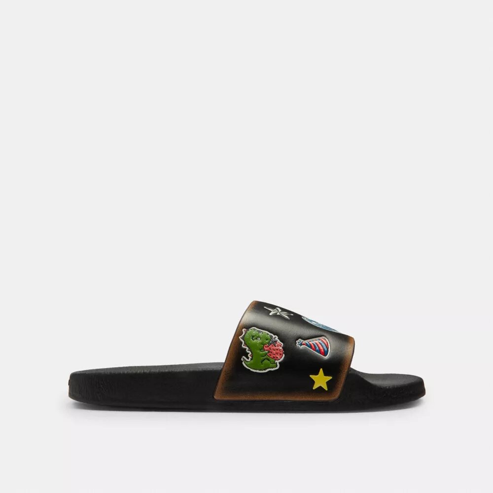 Rexy 10-årsdag Slides-sandaler med klistremerketrykk