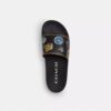 Rexy 10-årsdag Slides-sandaler med klistremerketrykk