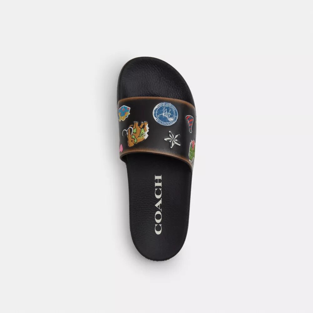 Rexy 10-årsdag Slides-sandaler med klistremerketrykk