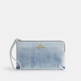 Stor håndleddsveske med glidelås i hjørnet i «Loved Denim»