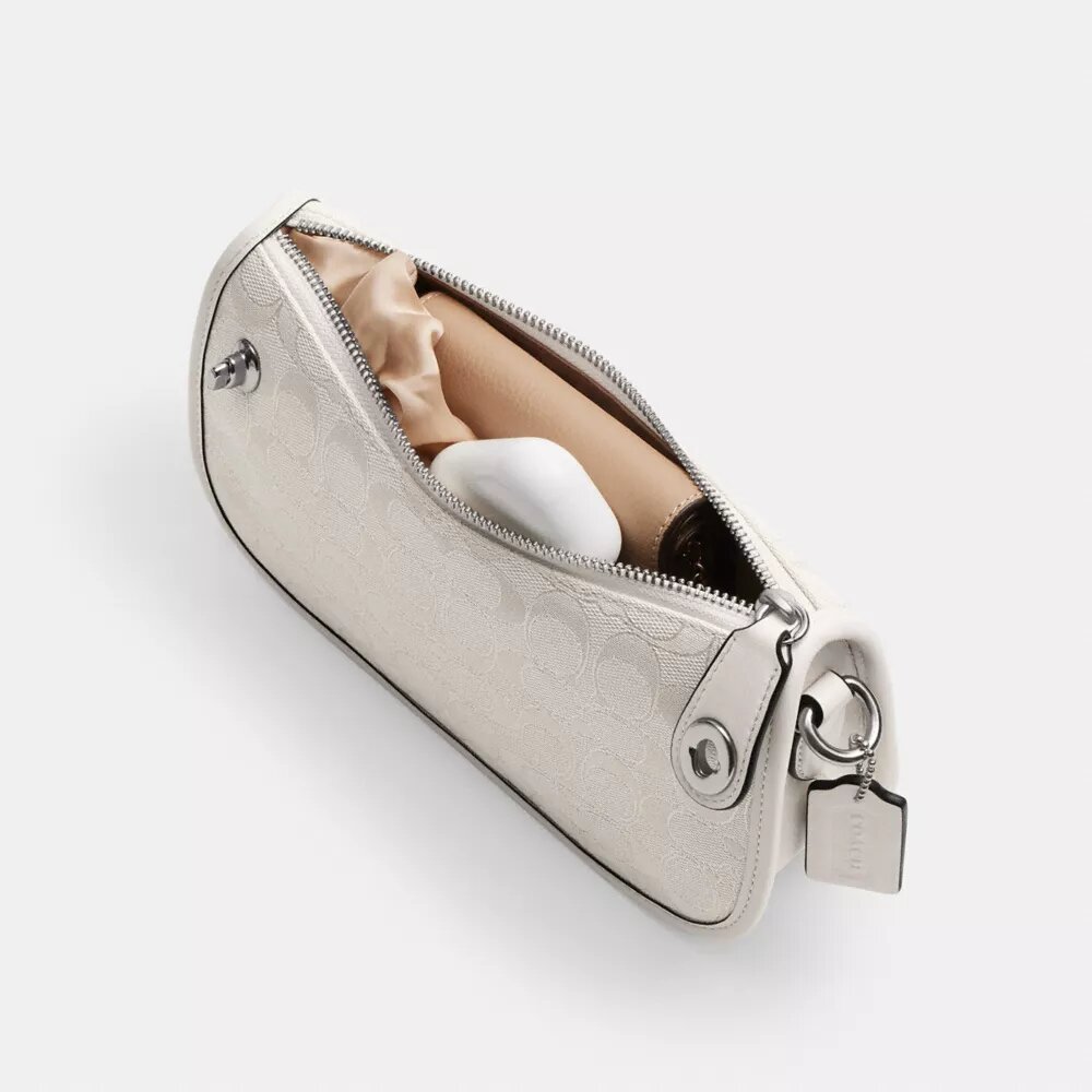 Swinger-vesker i signatur-jacquard