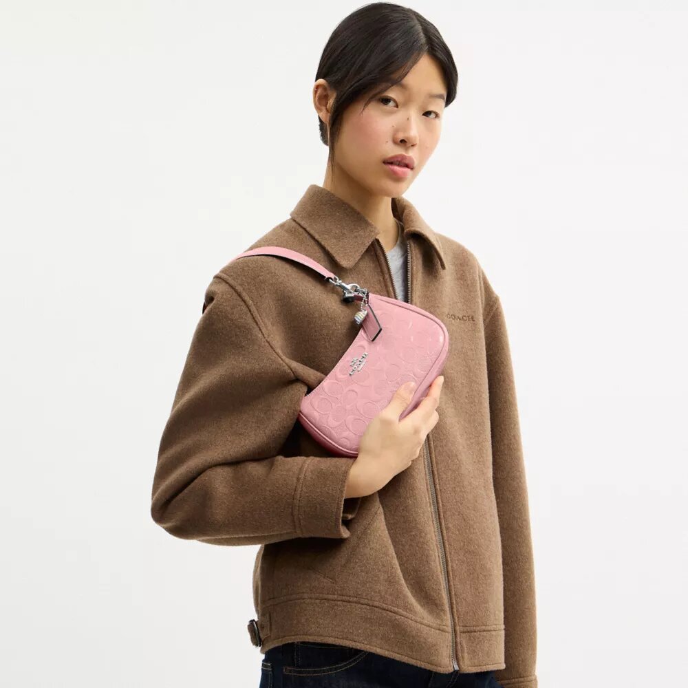 Teri Mini-crossbody-veske i signaturlær med hjerteanheng