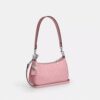 Teri Mini-crossbody-veske i signaturlær med hjerteanheng