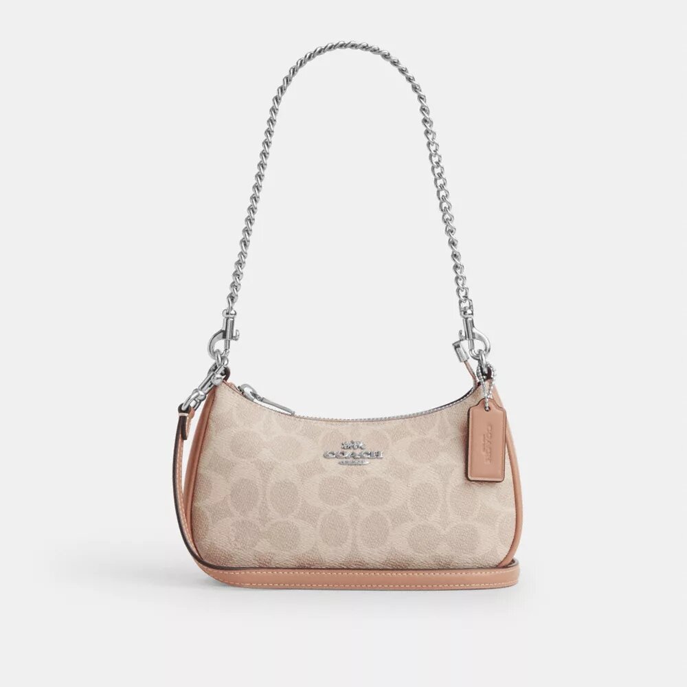 Teri Mini-veske med kryssrem i Signature Canvas