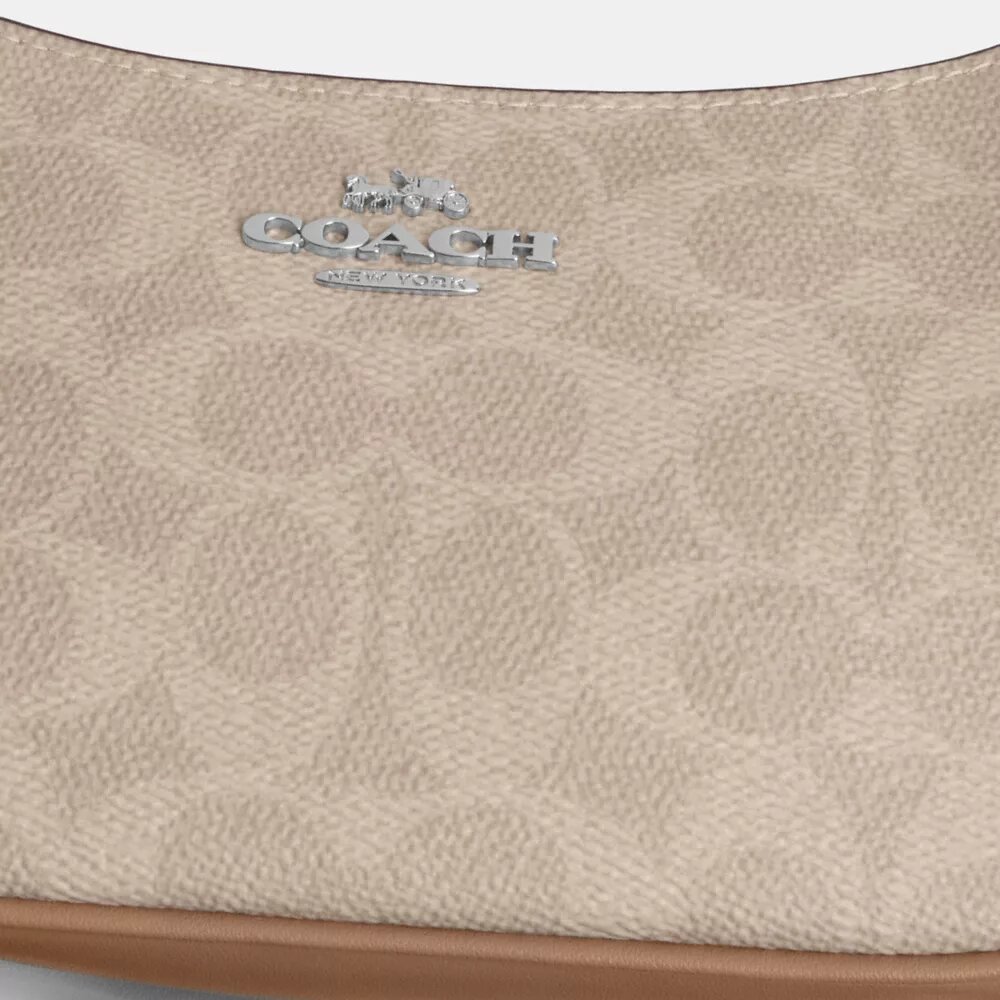 Teri Mini-veske med kryssrem i Signature Canvas