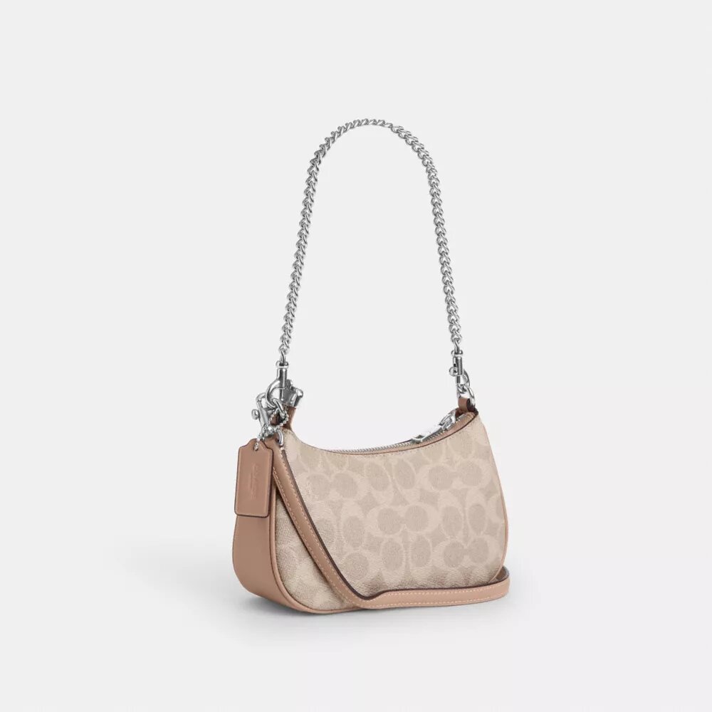 Teri Mini-veske med kryssrem i Signature Canvas