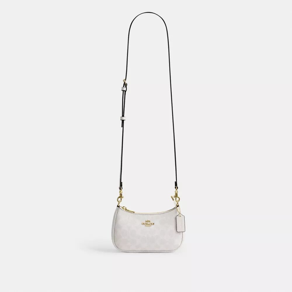 Teri Mini-veske med kryssrem i Signature Canvas