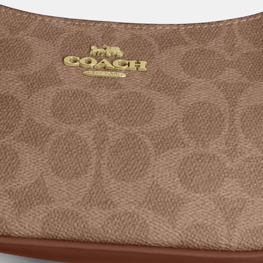 Teri Mini-veske med kryssrem i Signature Canvas