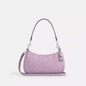 Teri skulderveske i signaturlær med hjerteanheng