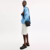 Tristan crossbody-veske 14 i Signature Canvas