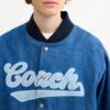 Varsity-jakke i denim av økologisk bomull